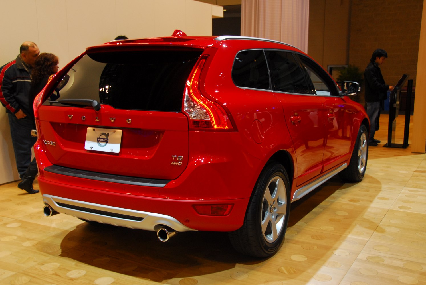 Red SUV rear with distinctive taillights and dual exhausts