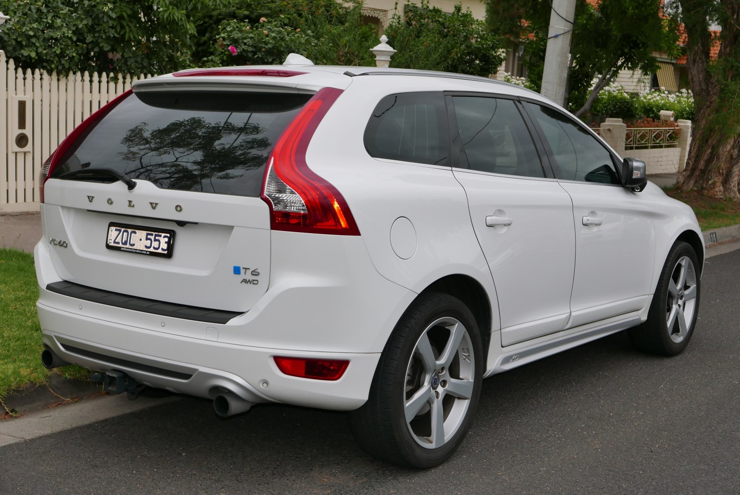 Rear view showing taillights, T6 AWD badge, rear windshield, alloy wheel