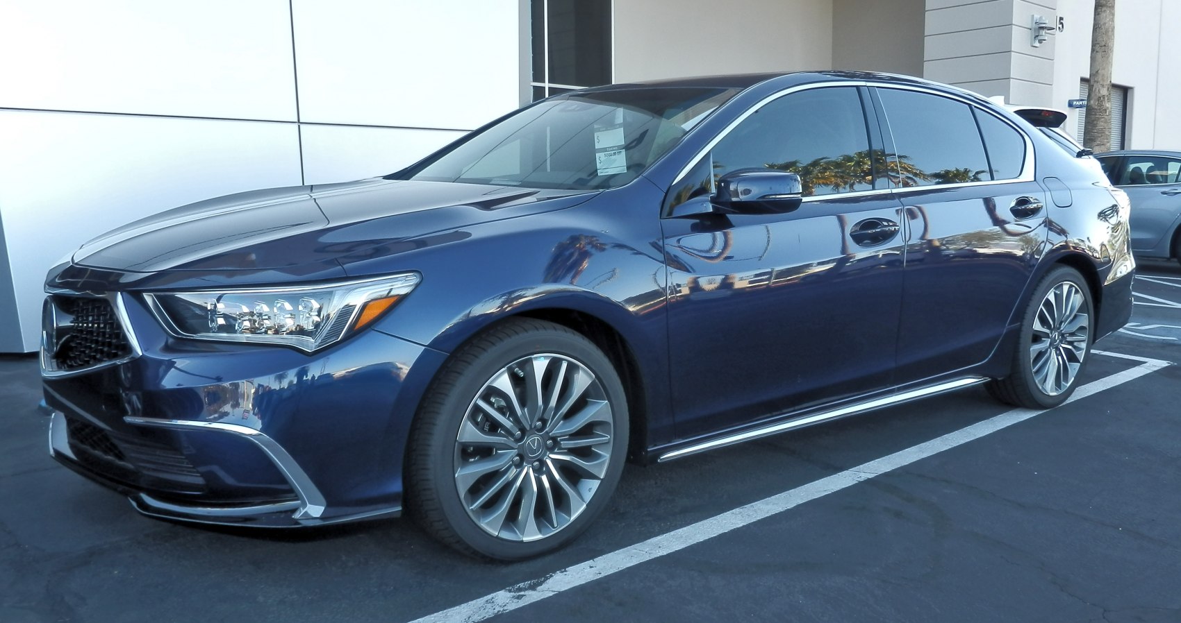 Luxury sedan with LED headlights and multi-spoke alloy wheels