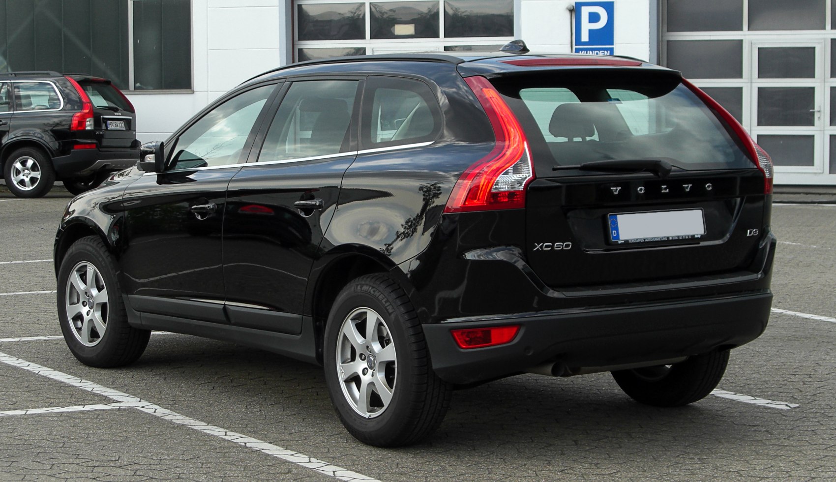 Rear side view with signature taillights and five-spoke wheels