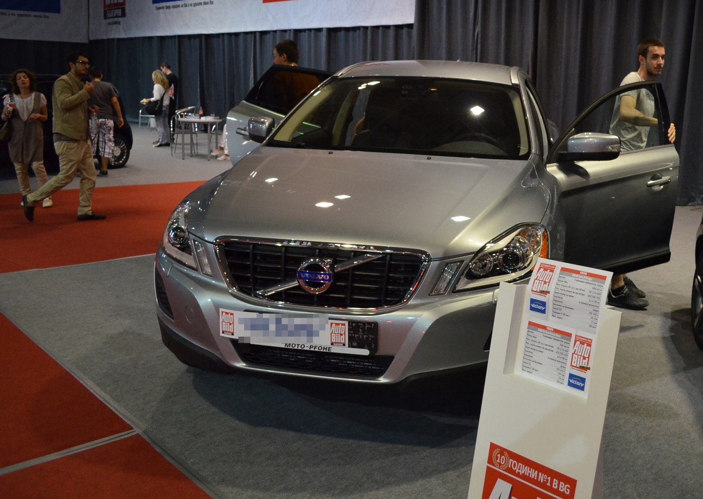 Front view with headlights, grille and open driver's door