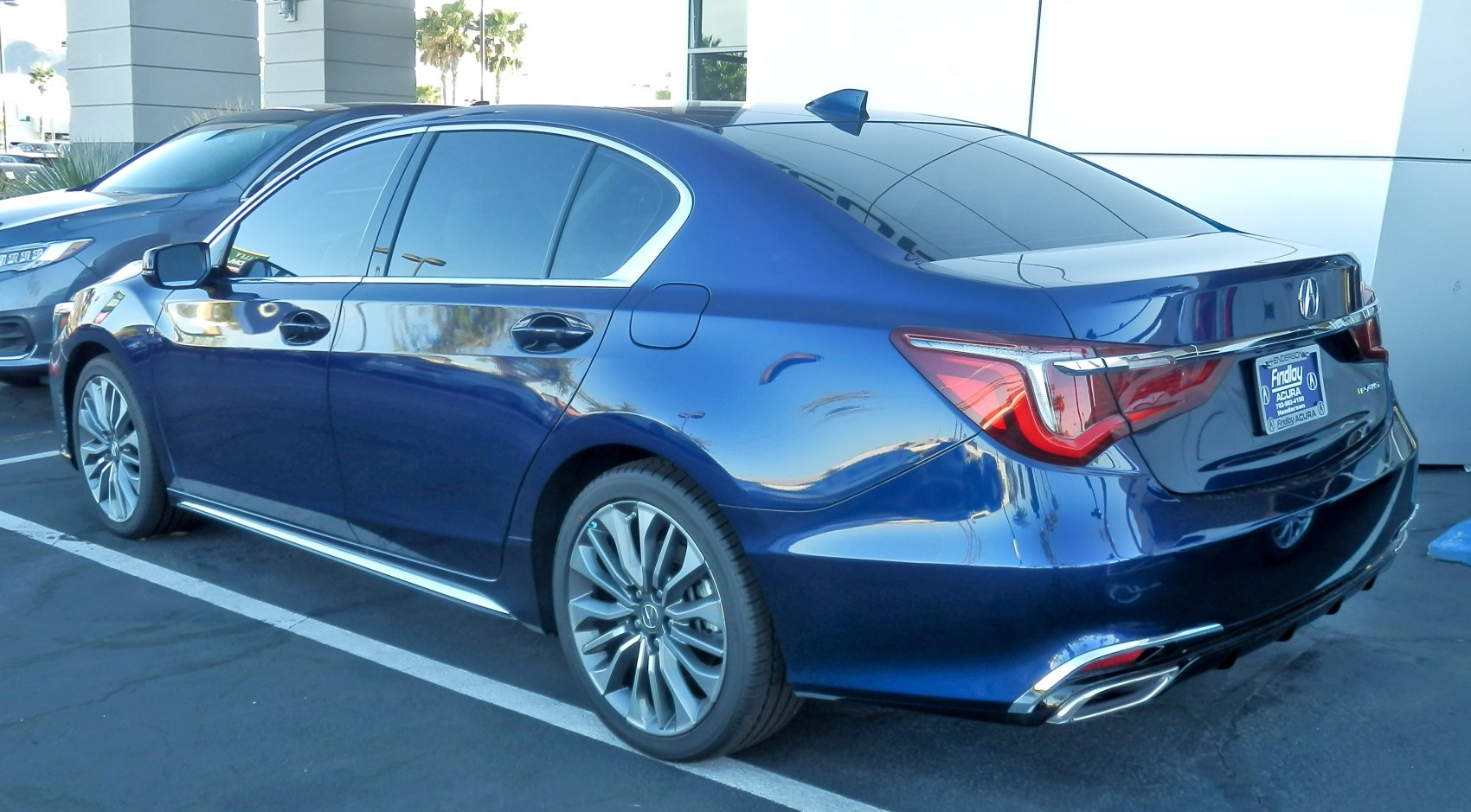 Rear and side profile with distinct taillights and alloy wheels