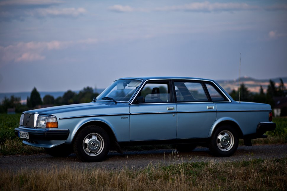 Boxy classic sedan side profile with metal hubcaps