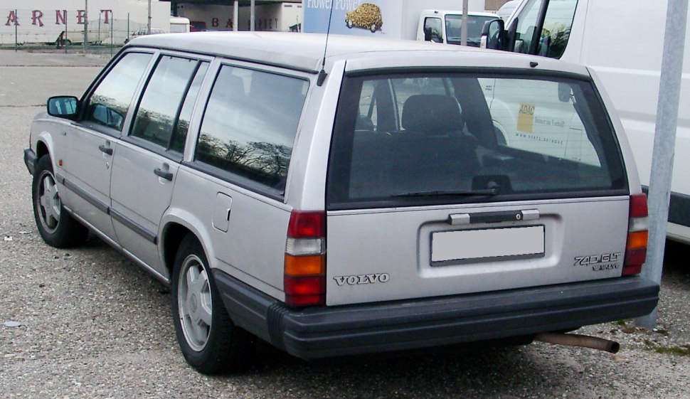Silver station wagon rear with large tailgate window and classic boxy design