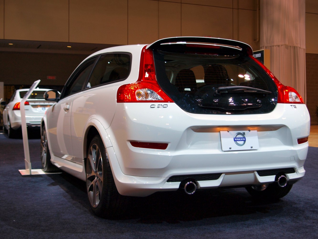 Rear view of a hatchback with dual exhaust and distinctive taillights