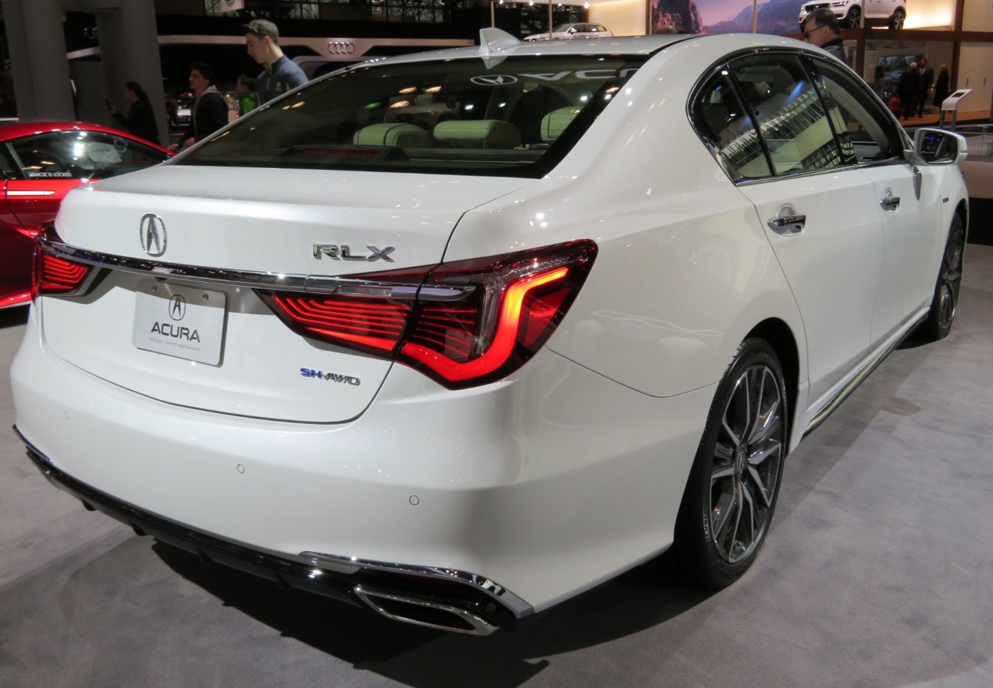 Rear view with distinctive LED tail lights and dual exhausts.