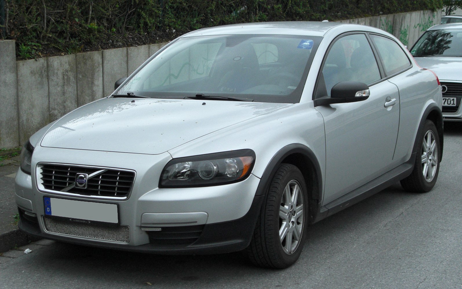 Front view with distinctive headlights and grille.