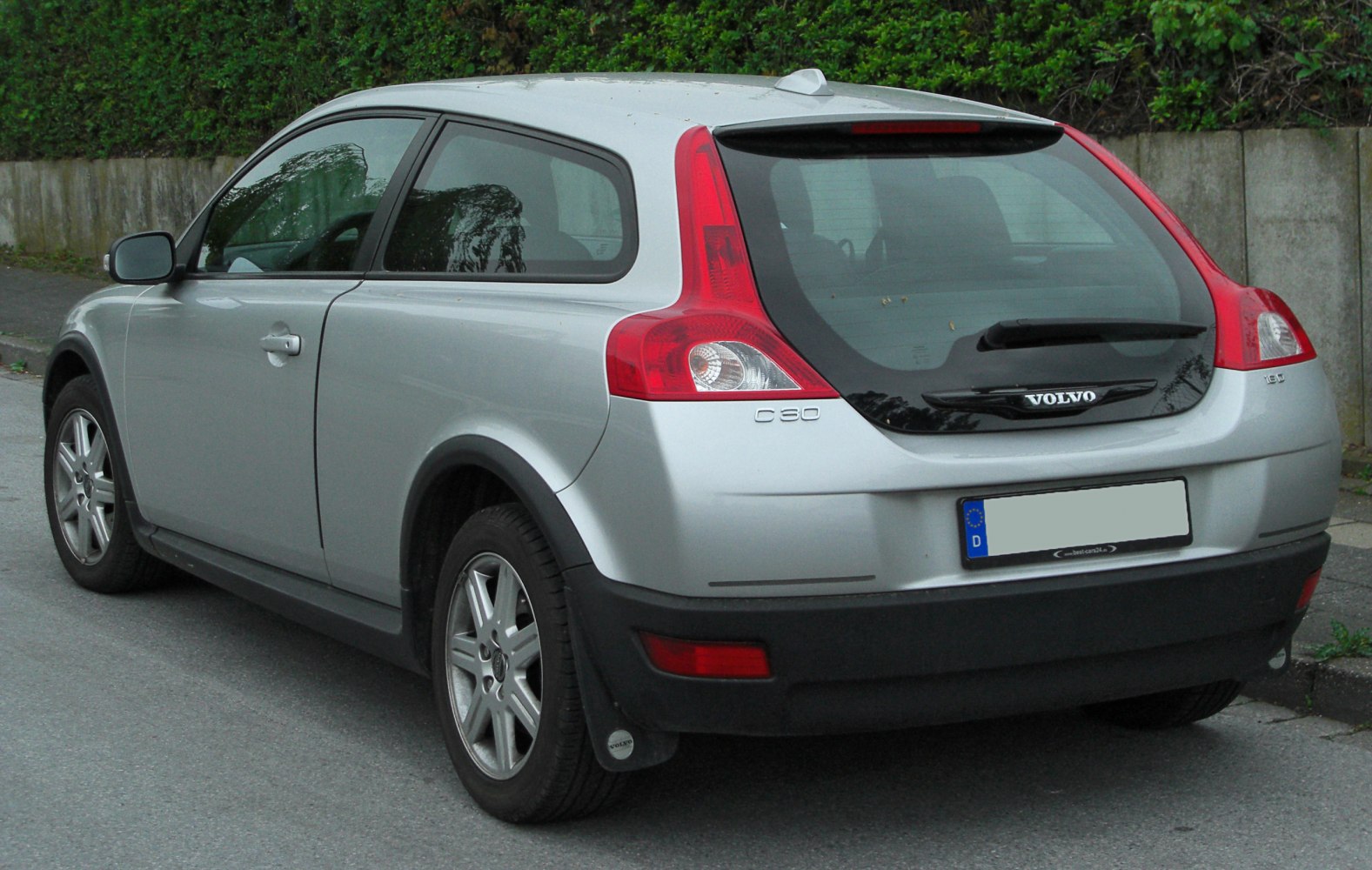 Rear and side profile of a compact hatchback with distinctive taillights and silver finish