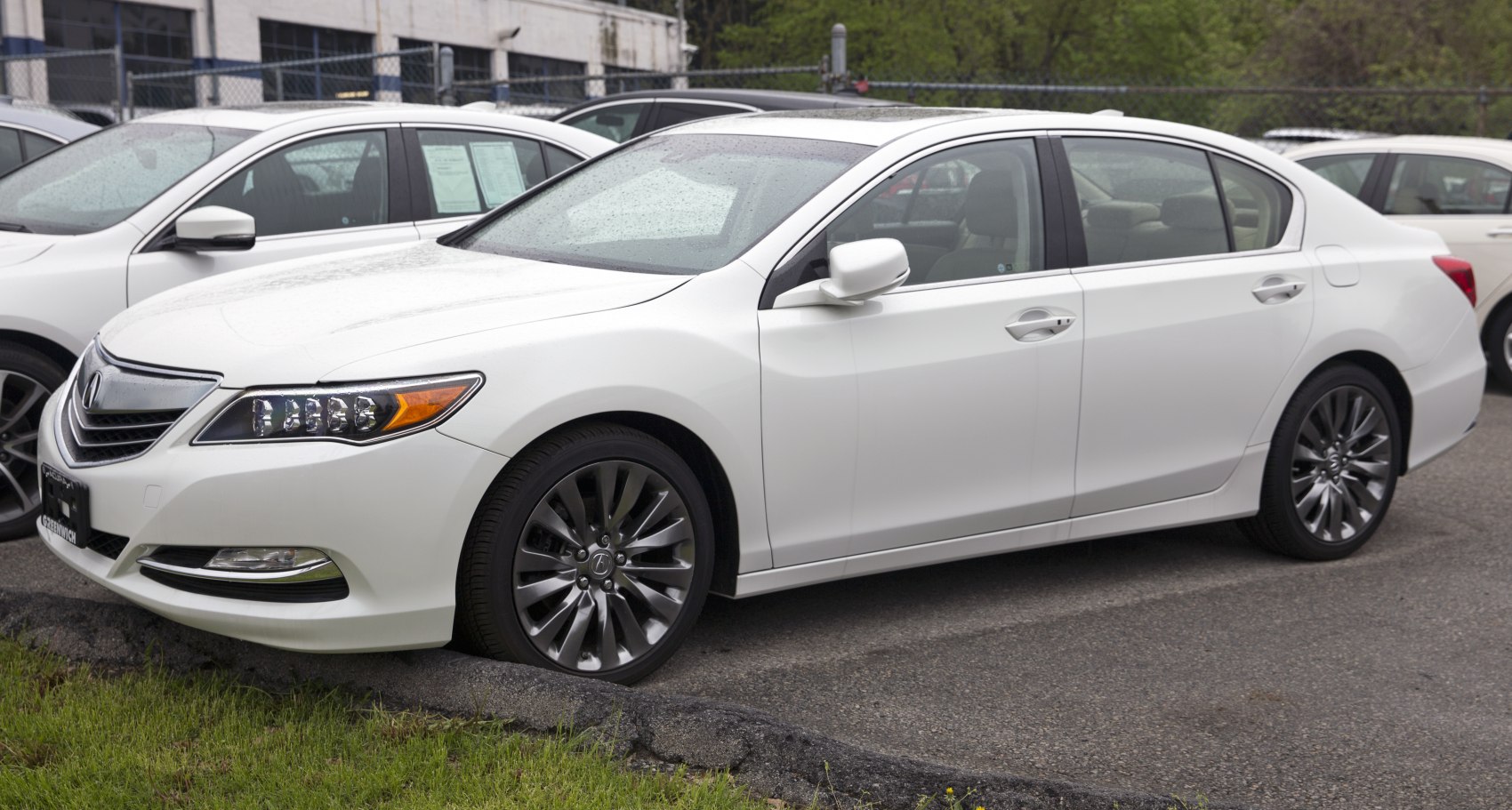 White sedan with LED headlights and multi-spoke alloy wheels