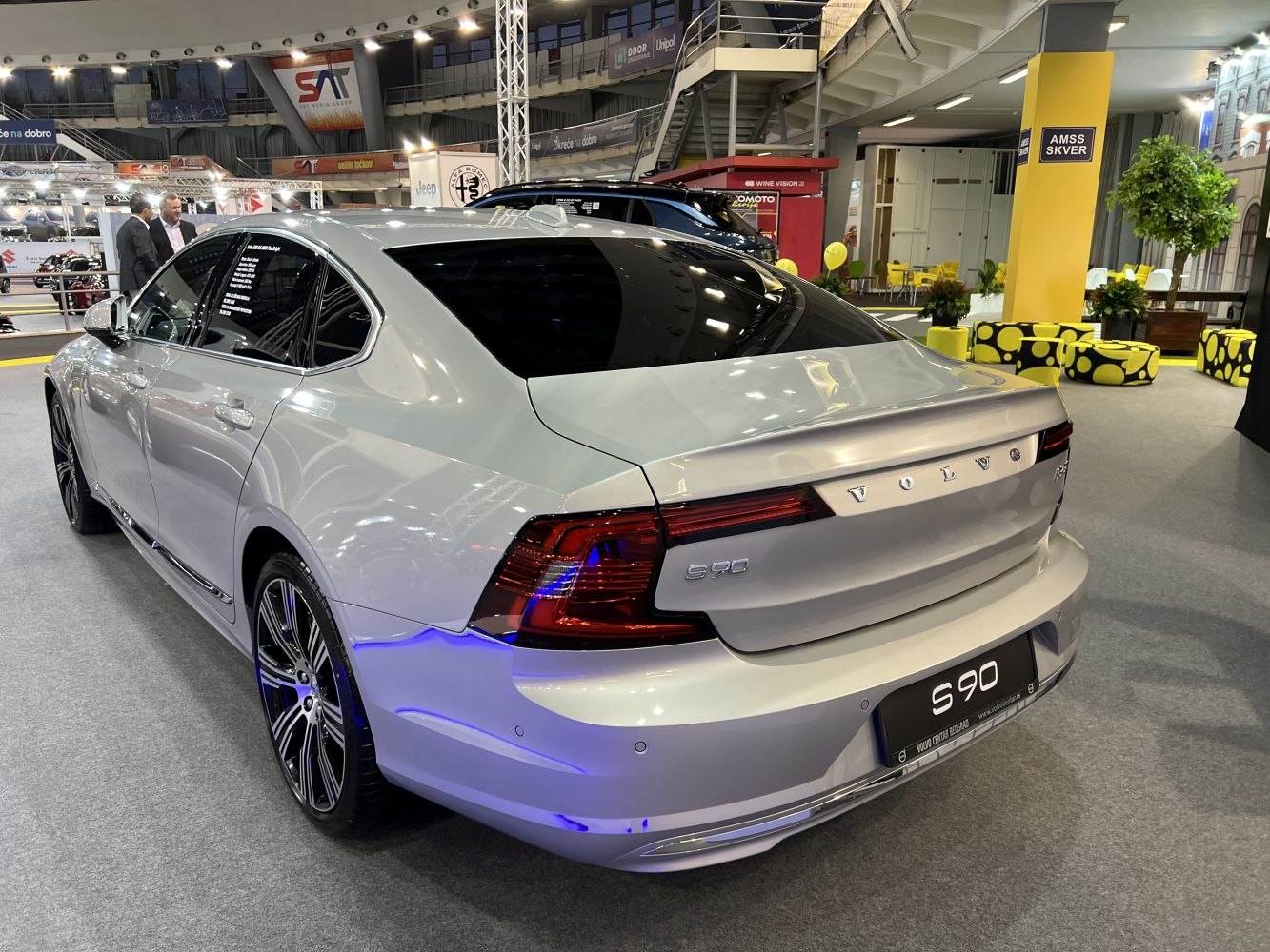 Sleek rear and side view of a luxury sedan with modern taillights and alloy wheels