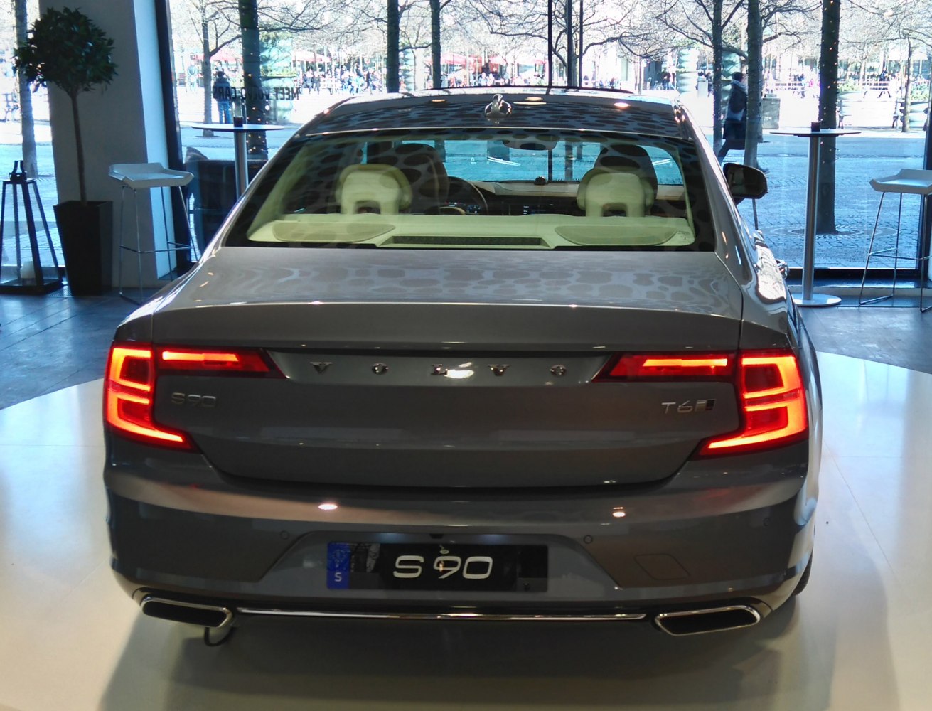 Rear view of sedan with LED taillights and dual exhaust