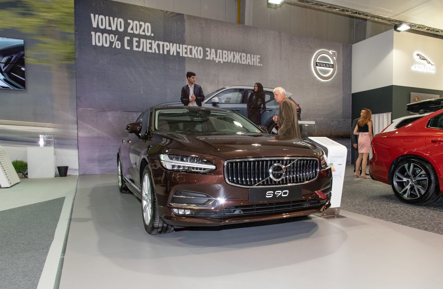 Luxury sedan front view with LED headlights and vertical chrome grille
