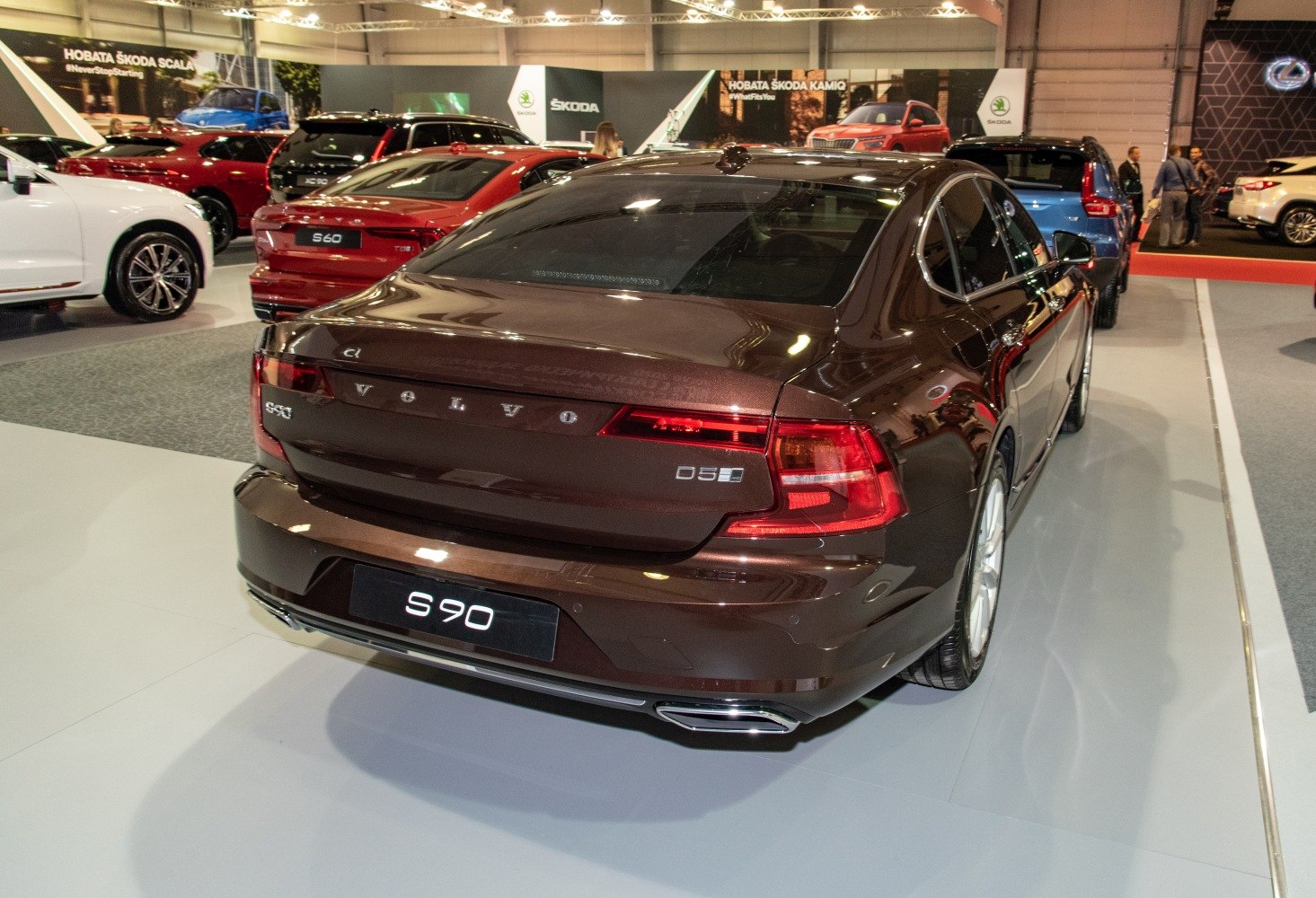 Brown sedan rear view with distinct taillights and dual exhaust
