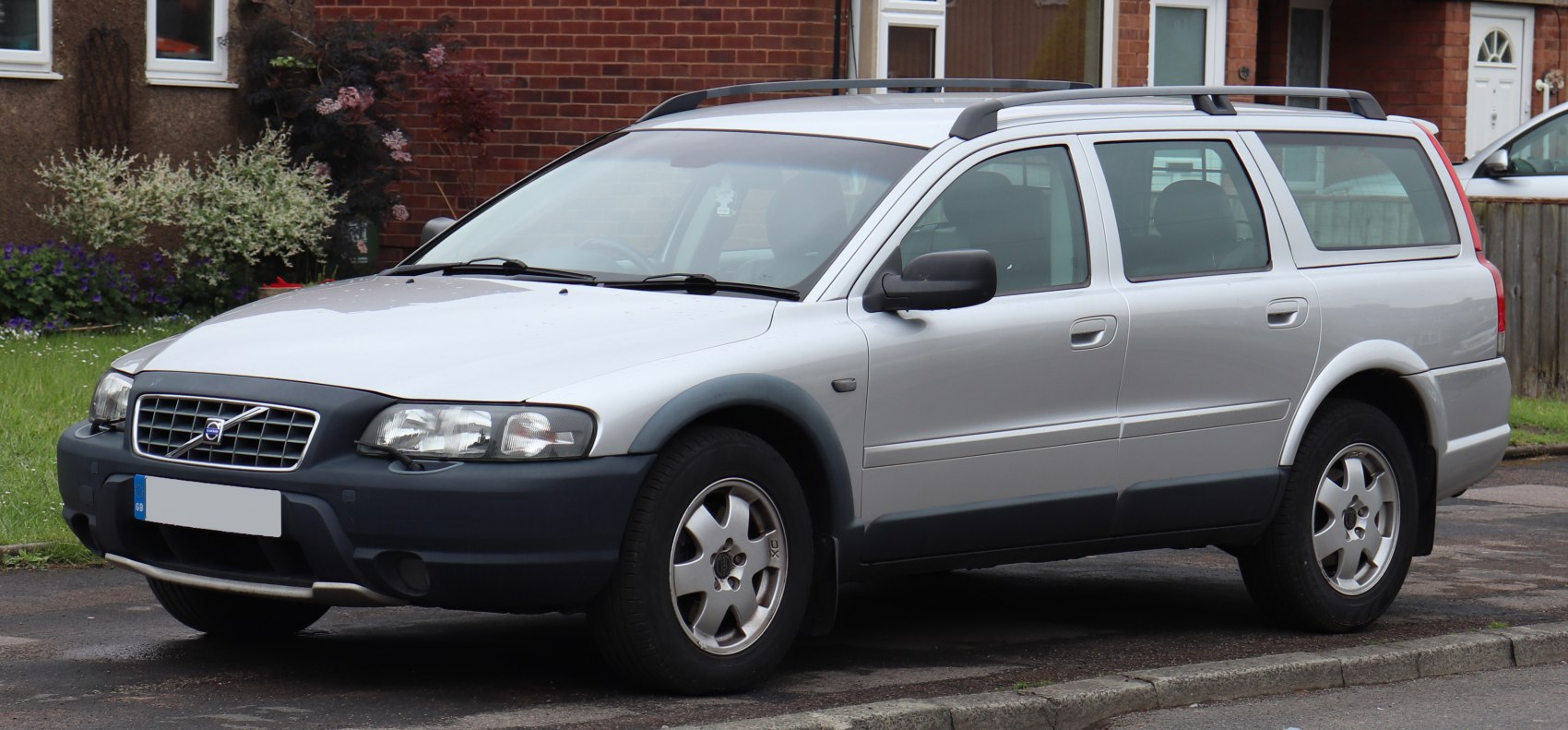 Station wagon with roof rails and protective black plastic cladding