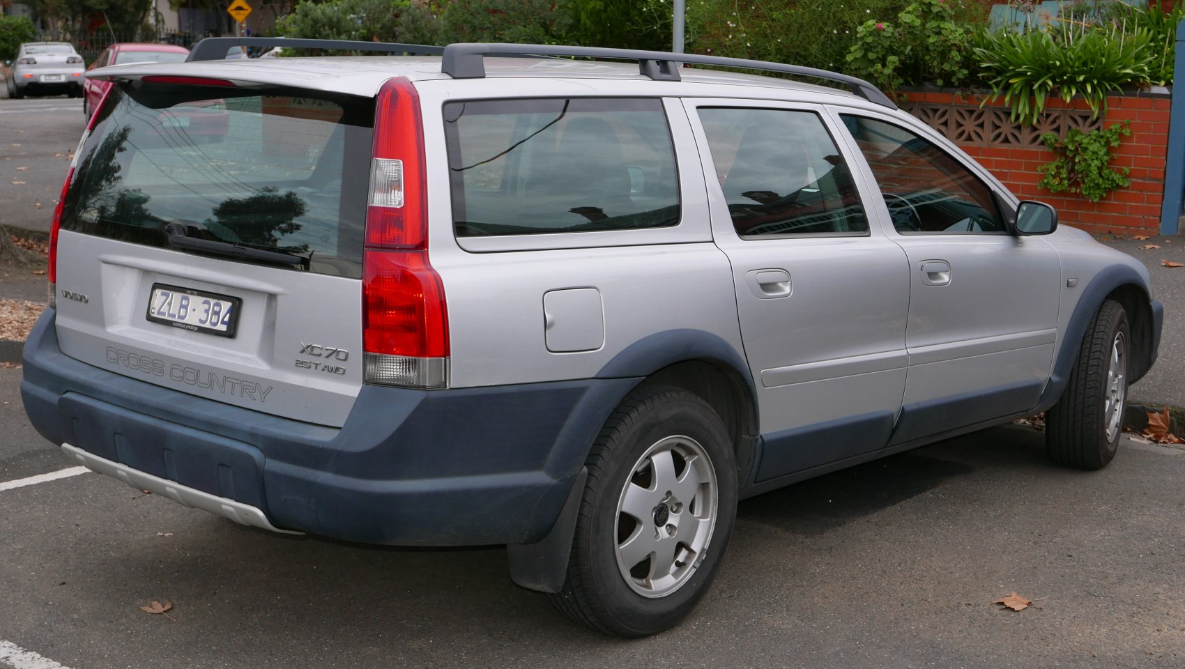 Rear side with tall red tail lamps and rugged bumper