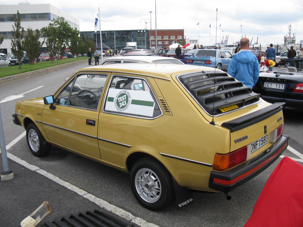 Three-door hatchback with rear window louvers and alloy wheels