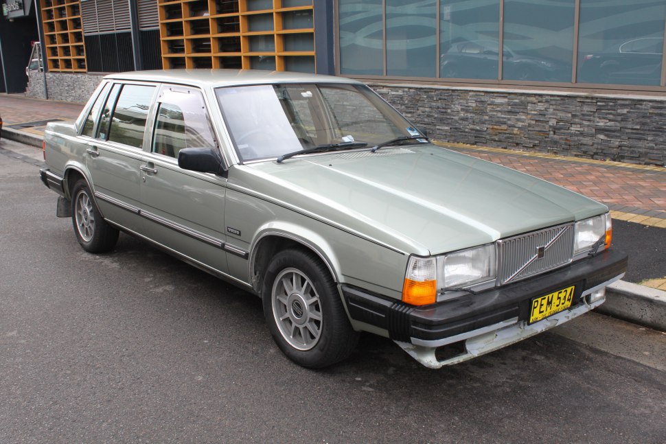 Boxy front design with rectangular headlights and alloy wheels on classic sedan.