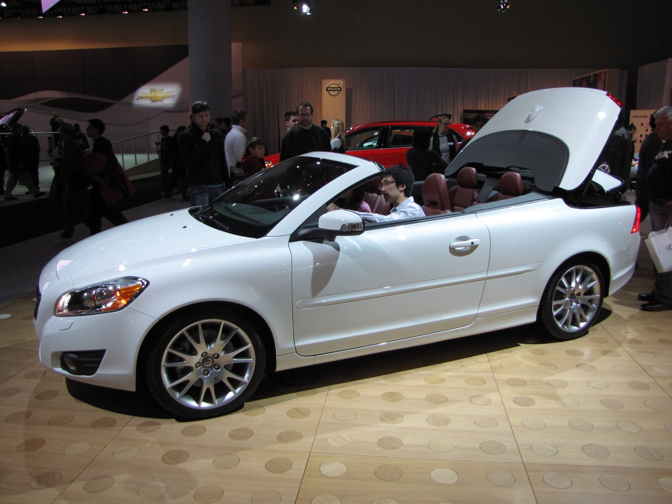 White convertible with retractable hardtop folding roof open