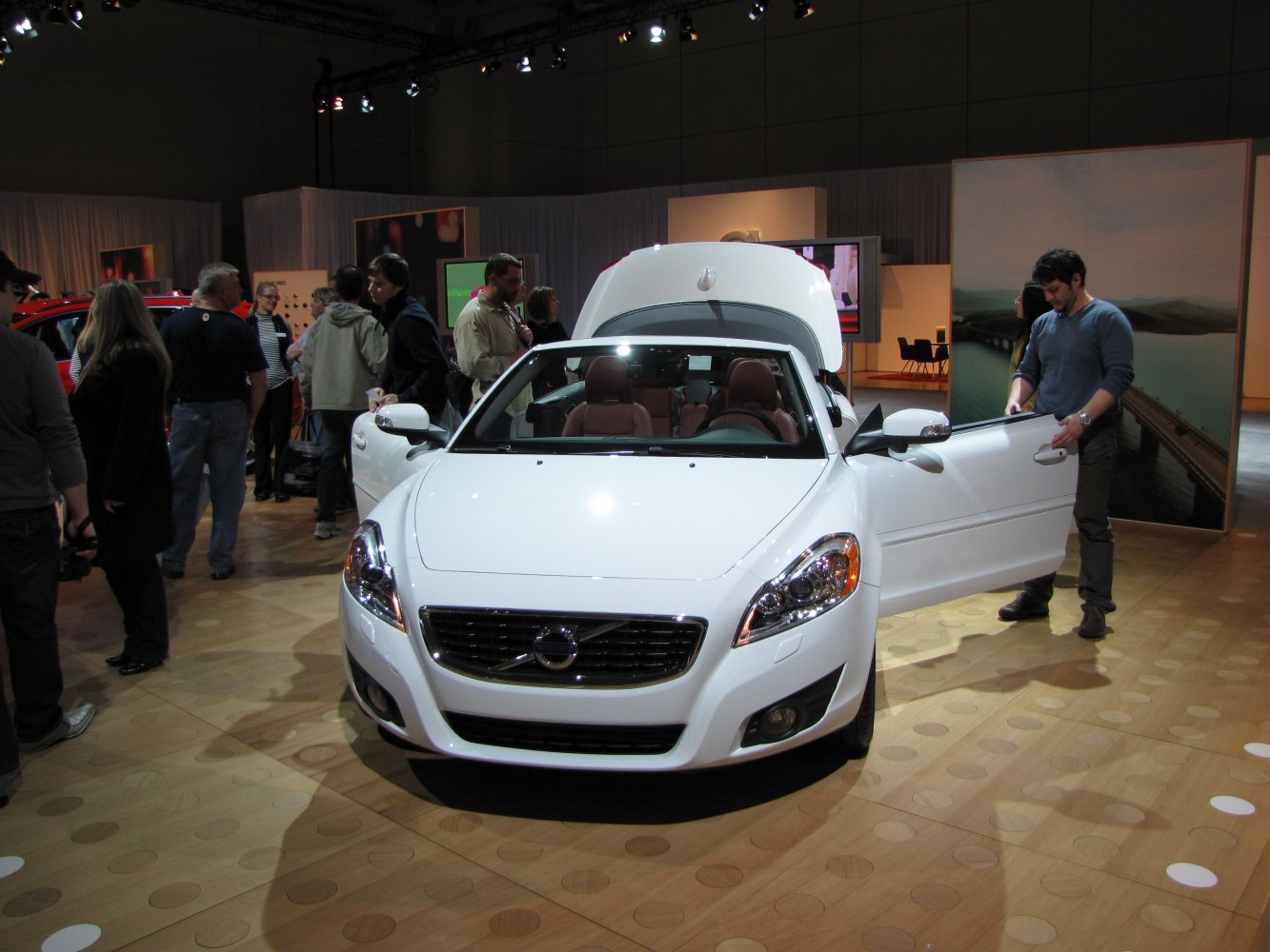 Front view of convertible with open doors and trunk