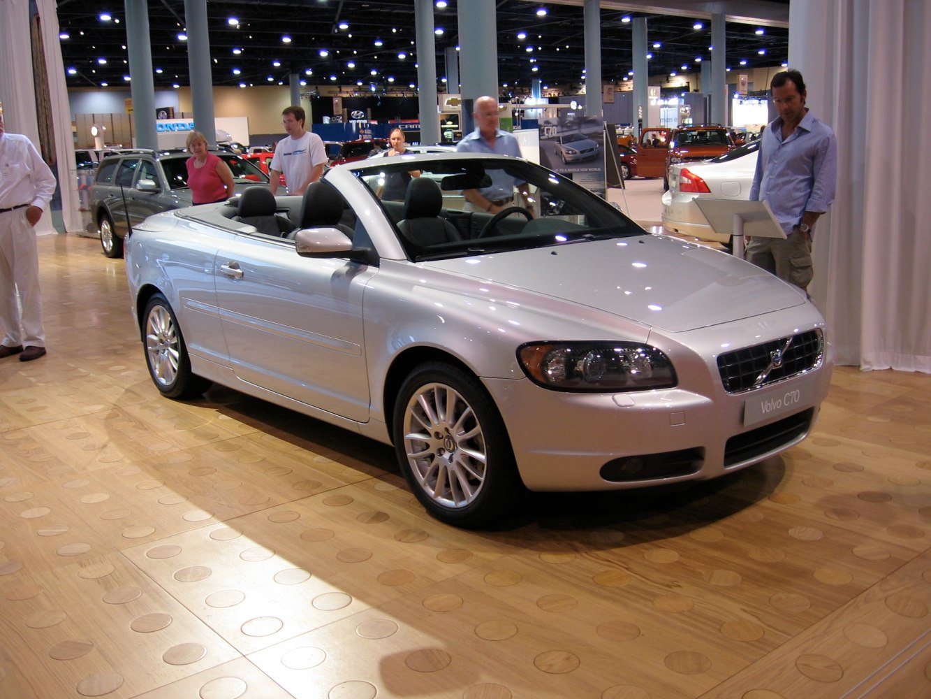 Silver two-door convertible with sporty alloy wheels and open-top design