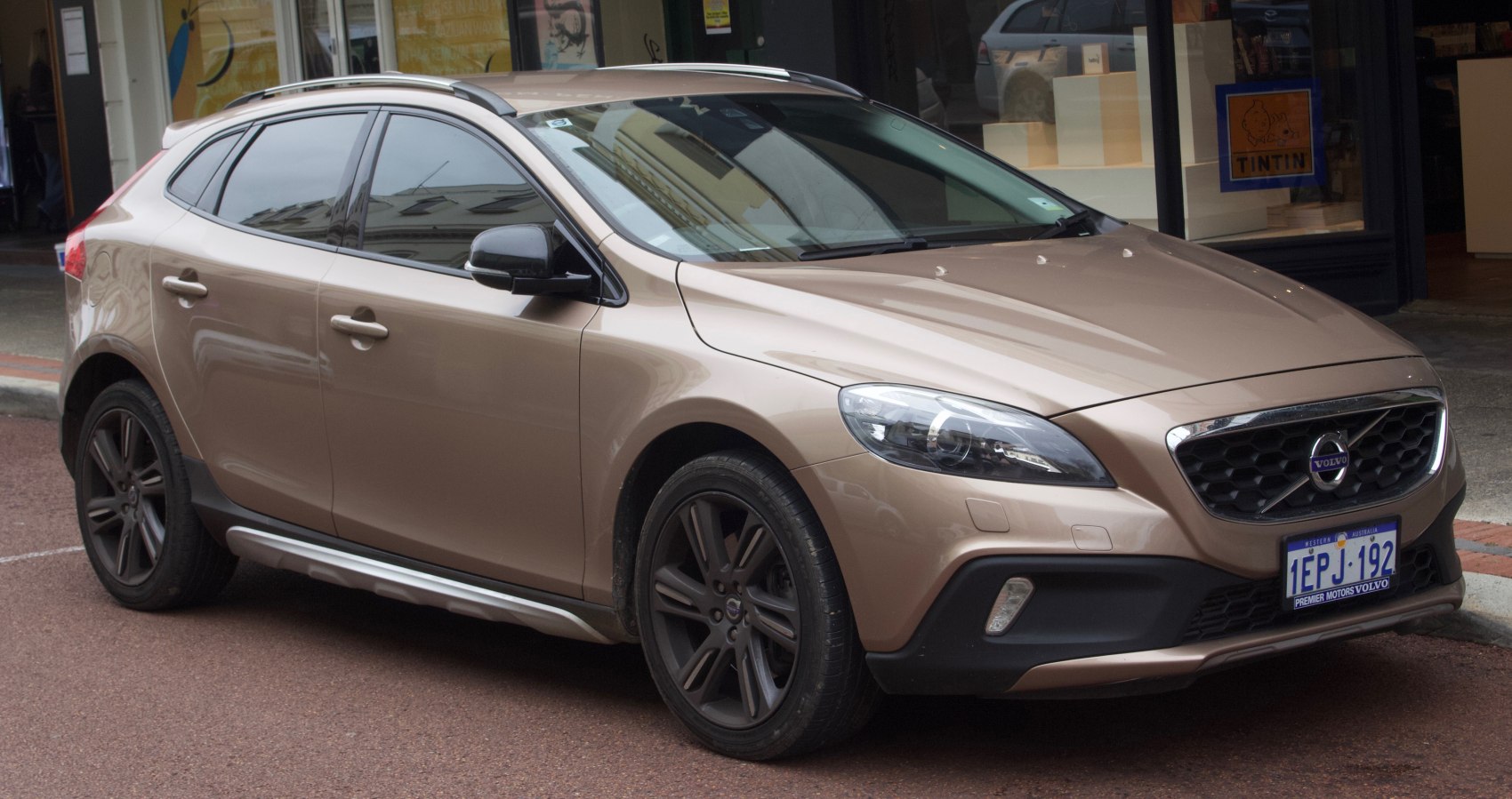 Front-side view of sporty vehicle with sleek headlights and alloy wheels