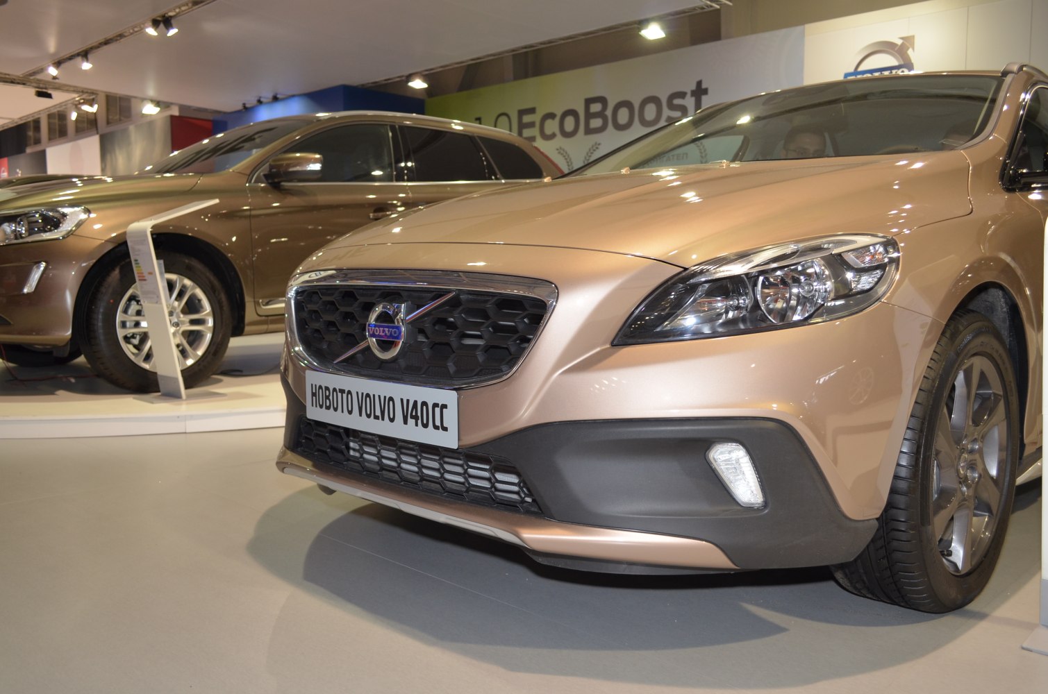 Close-up of front grille and headlight of a car in a showroom