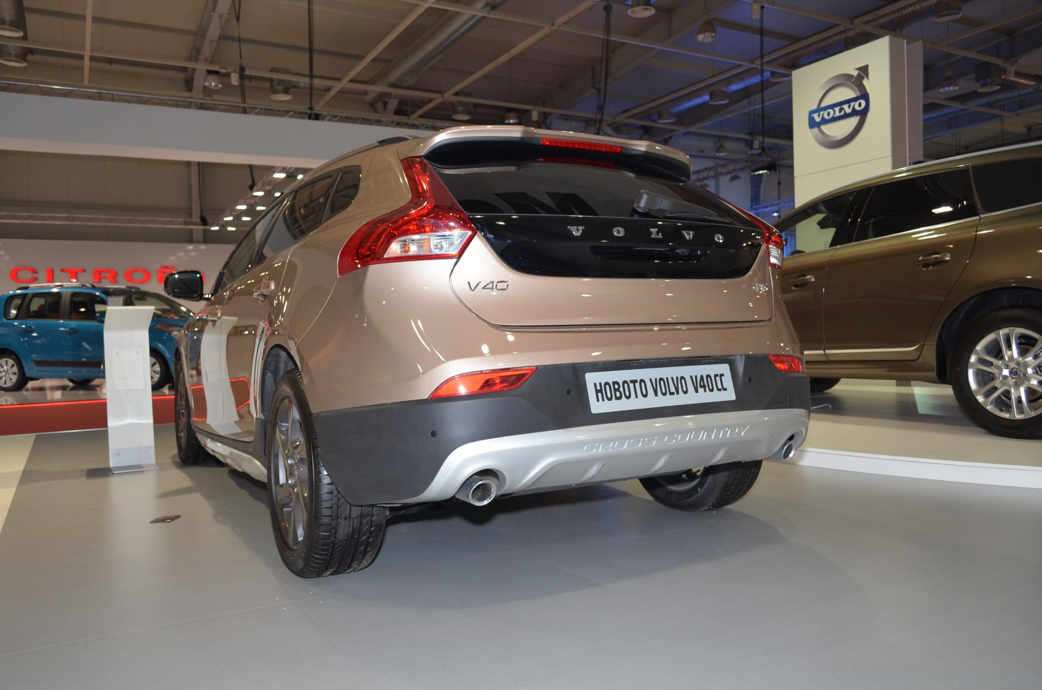 Rear view of hatchback with distinctive curved taillights and single exhaust pipe