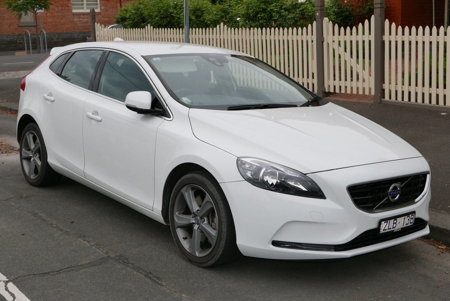 Front side view of hatchback with sleek headlights and aerodynamic body