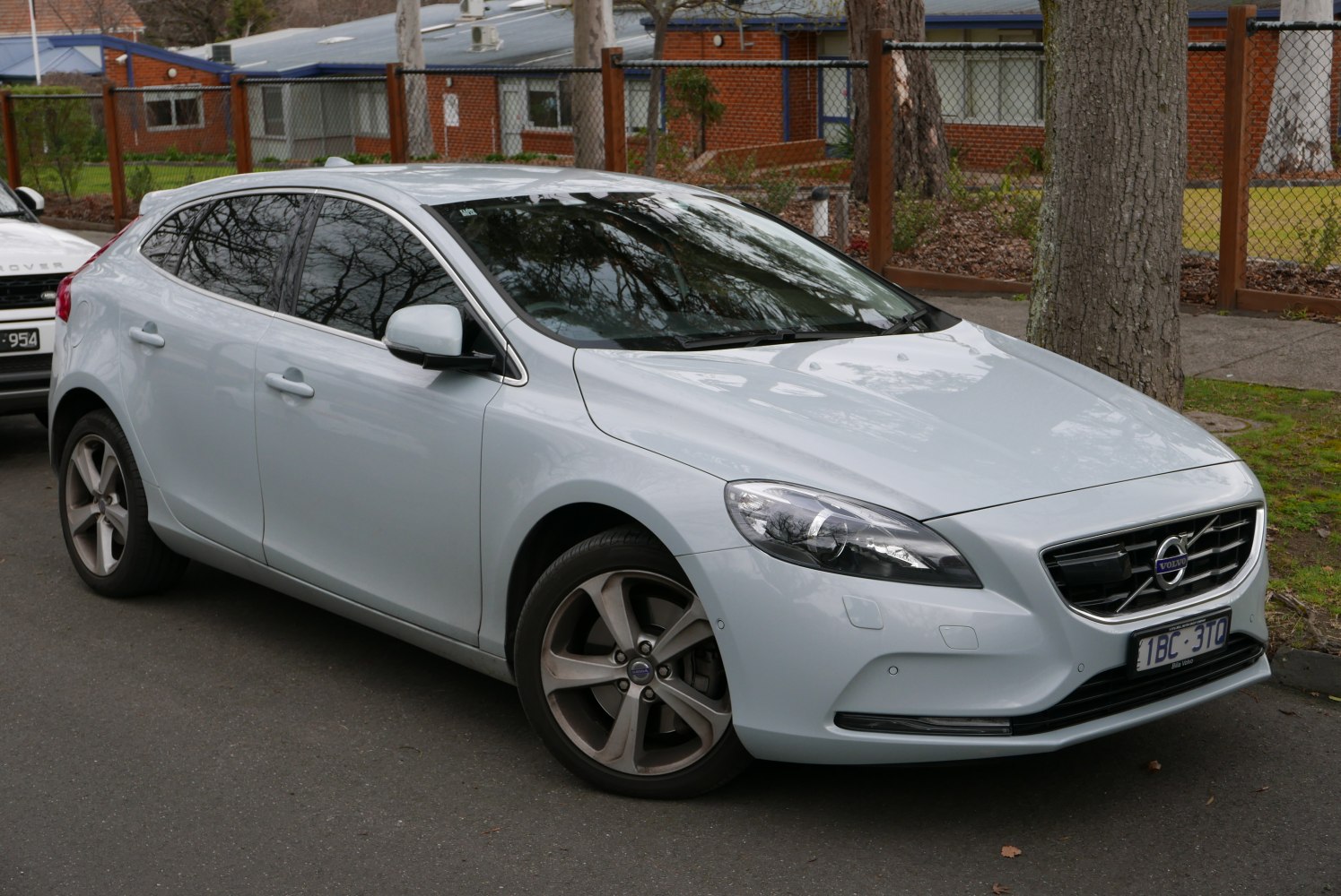 Front side view of a compact hatchback with alloy wheels
