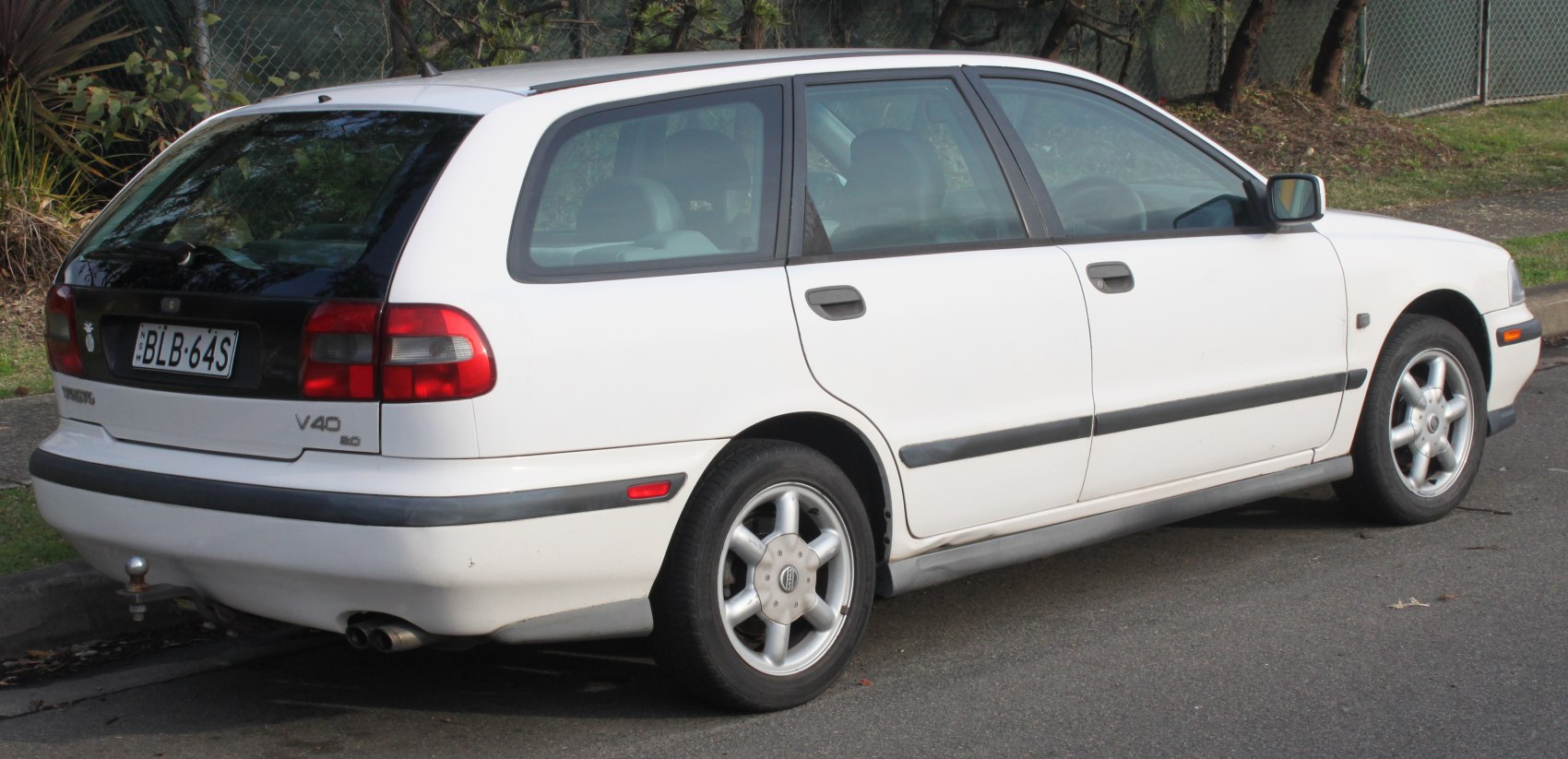 Rear and side view of a station wagon with alloy wheels and distinctive taillights