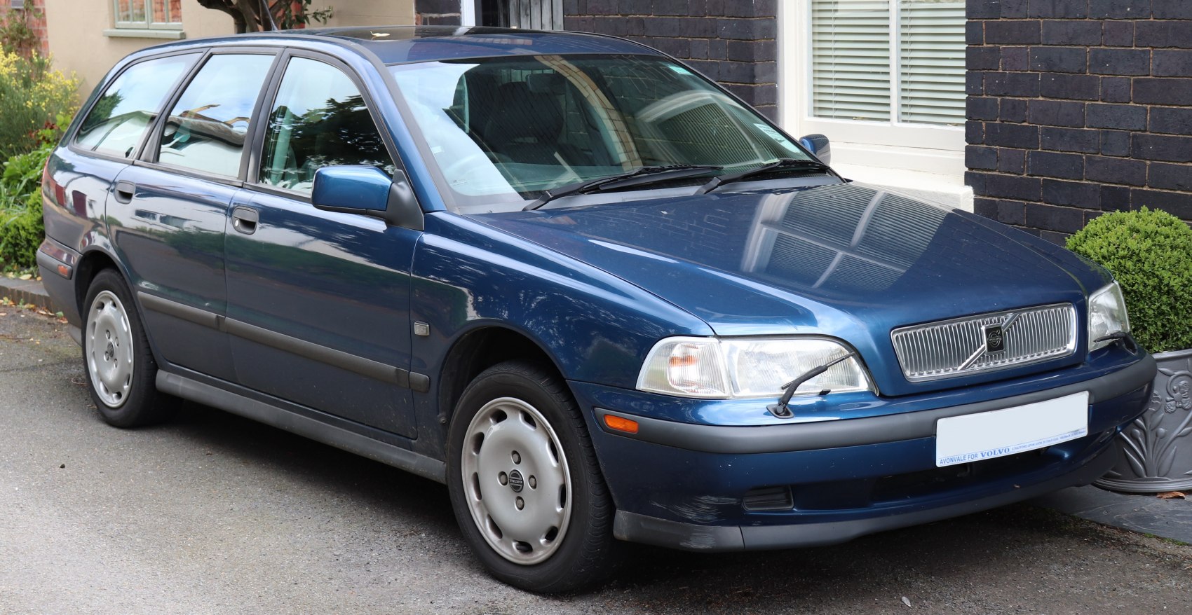 Front side view of classic 1996 Volvo V40 Combi wagon in blue
