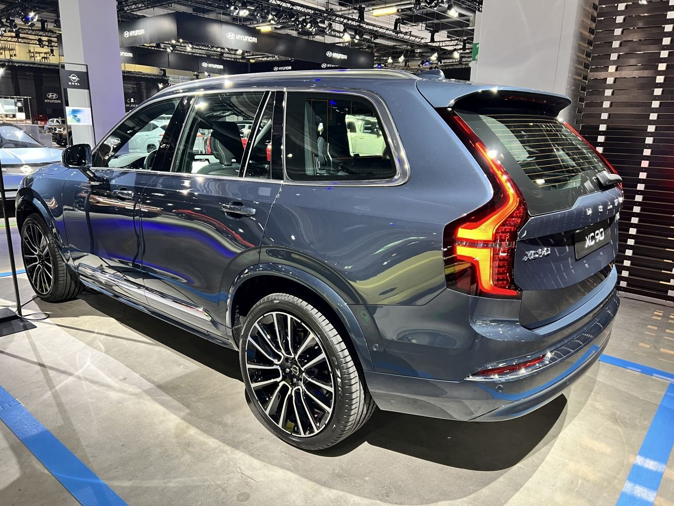 Rear-side view of SUV with modern LED taillights and large alloy wheels.