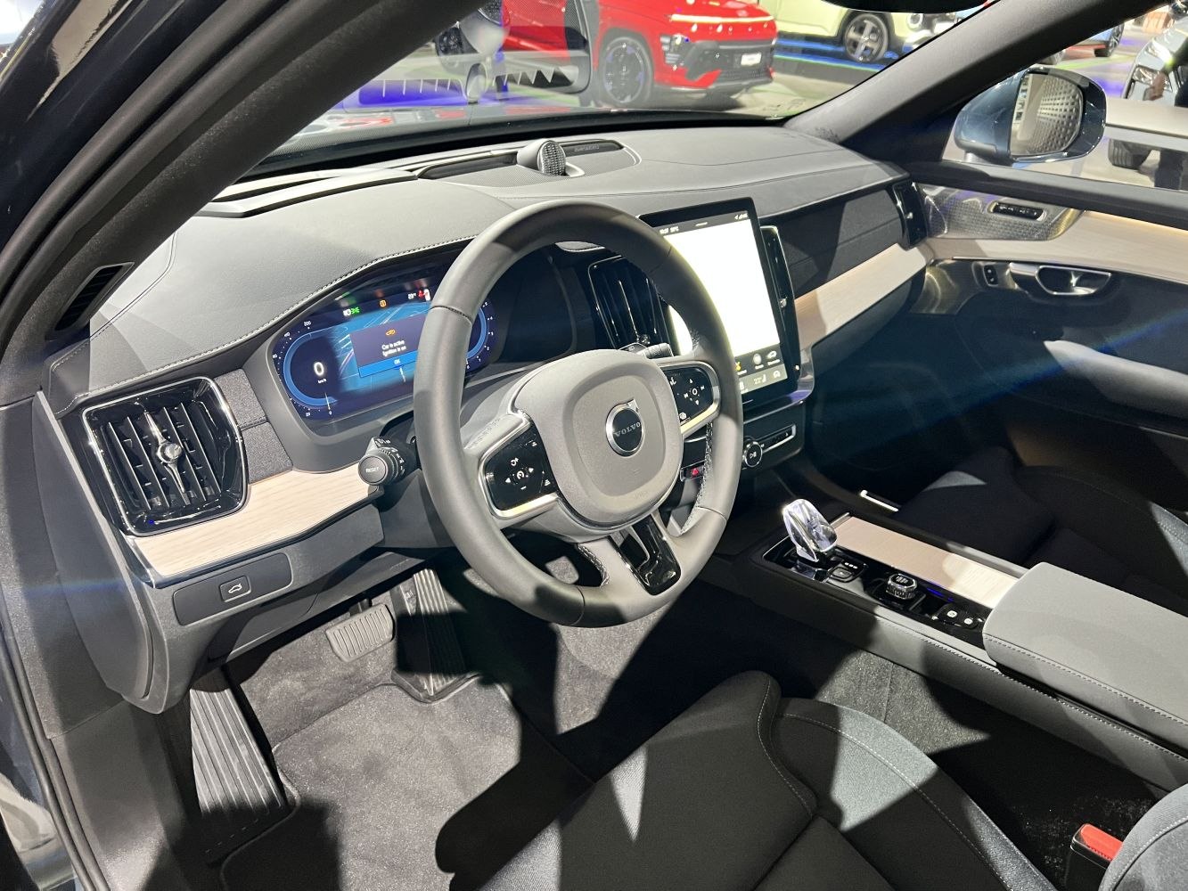 Digital dashboard and touchscreen center console with steering wheel and crystal gear shifter