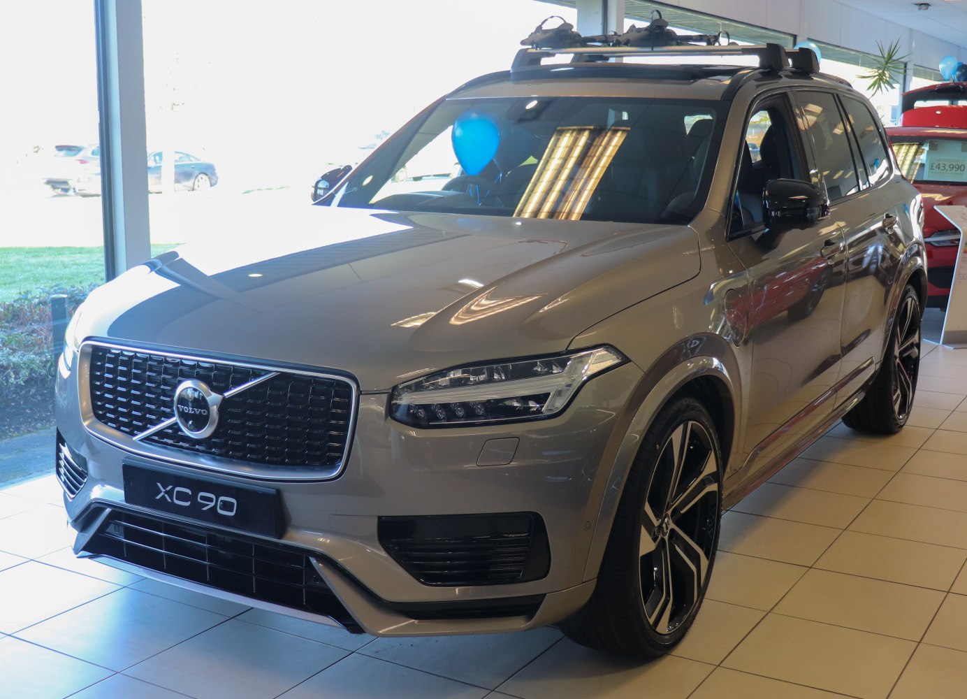 Front view with signature grille, LED headlights, alloy wheels