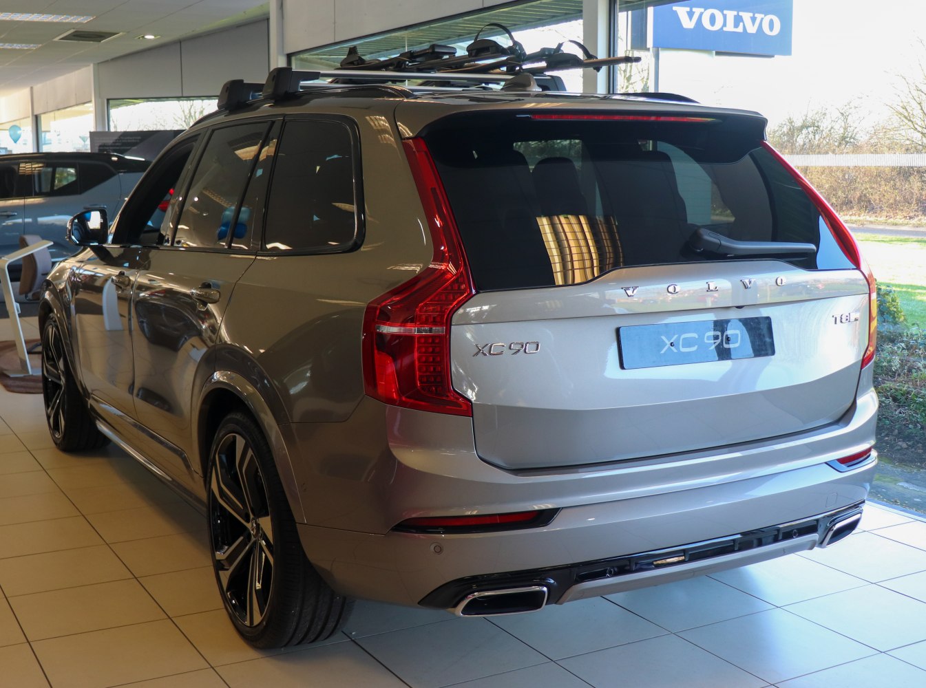 Rear and side view with distinctive taillights and roof rails