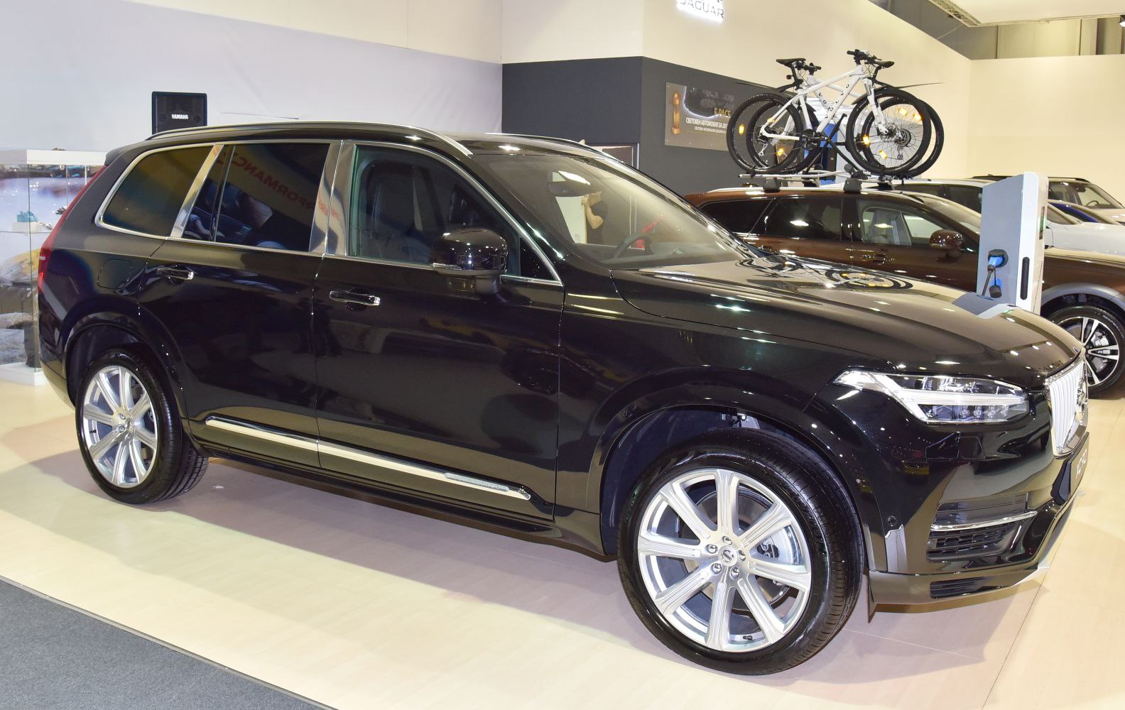 Side profile of black luxury SUV with alloy wheels