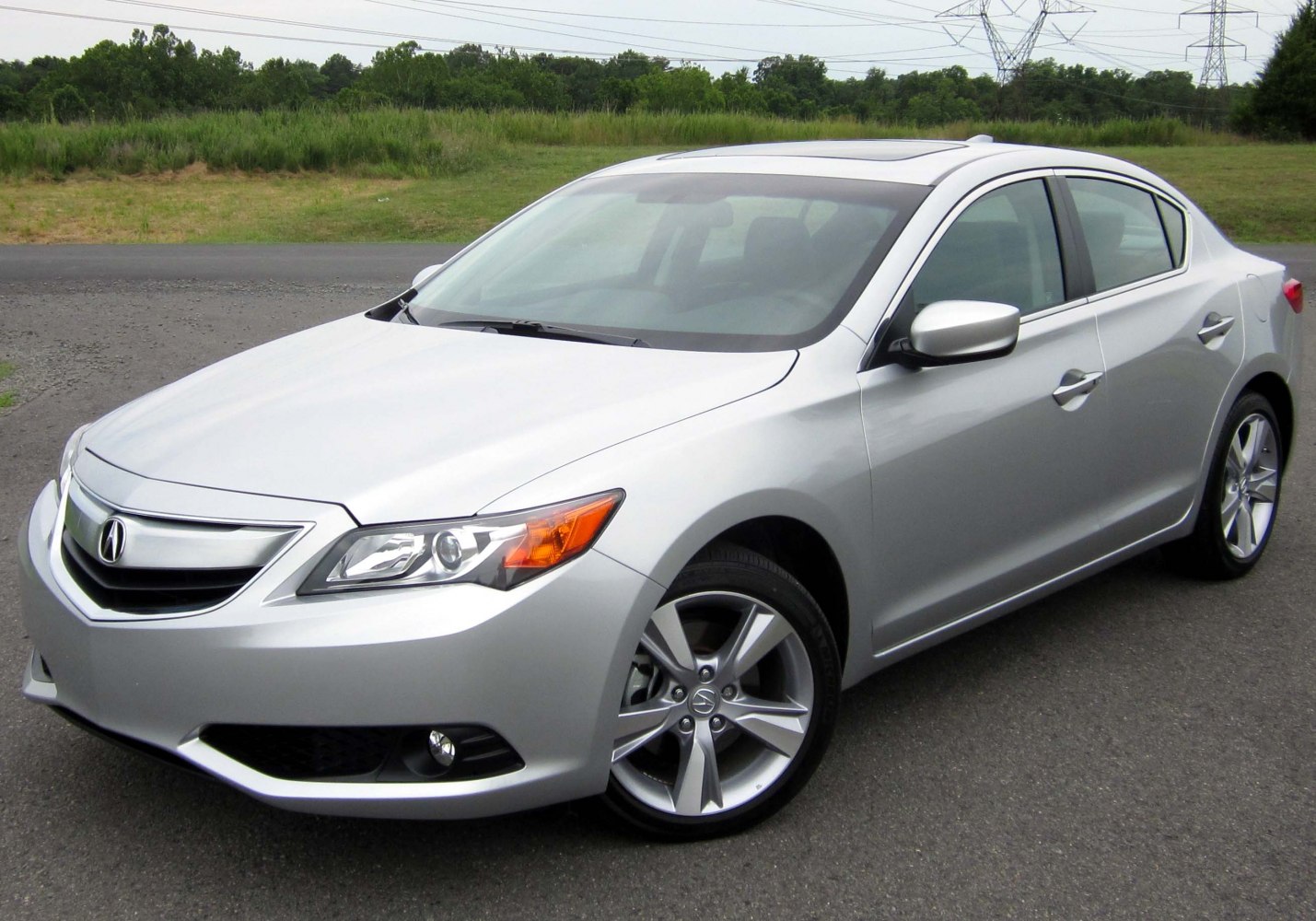 Front-side view of silver sedan with alloy wheels