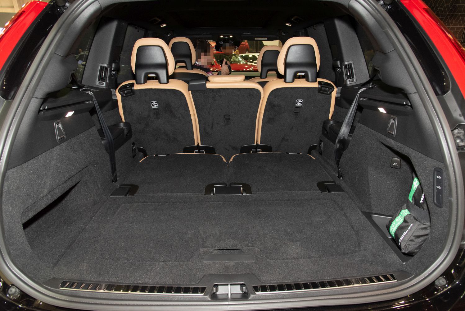 Rear cargo area with folded seats and premium upholstery in an SUV