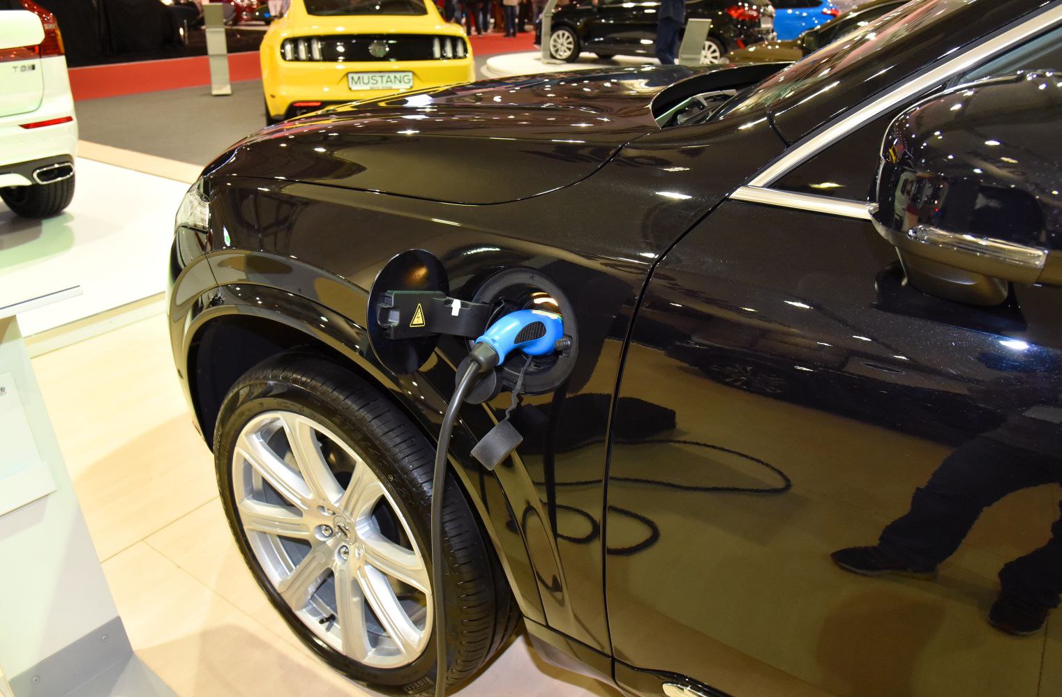 Close-up of hybrid electric charging port and cable on SUV