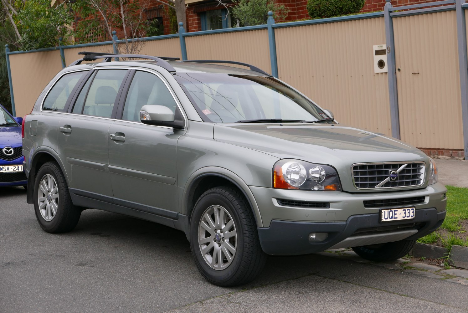 Front side view of facelift SUV with distinct headlights and grille