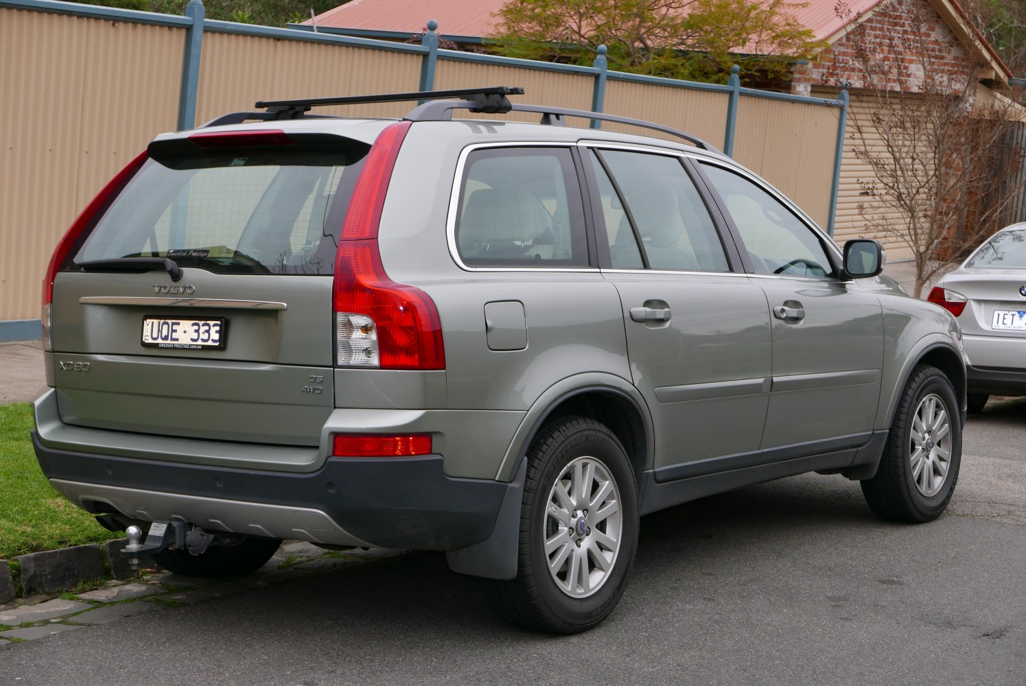 Rear and side view of SUV with distinctive tail lights and roof rails