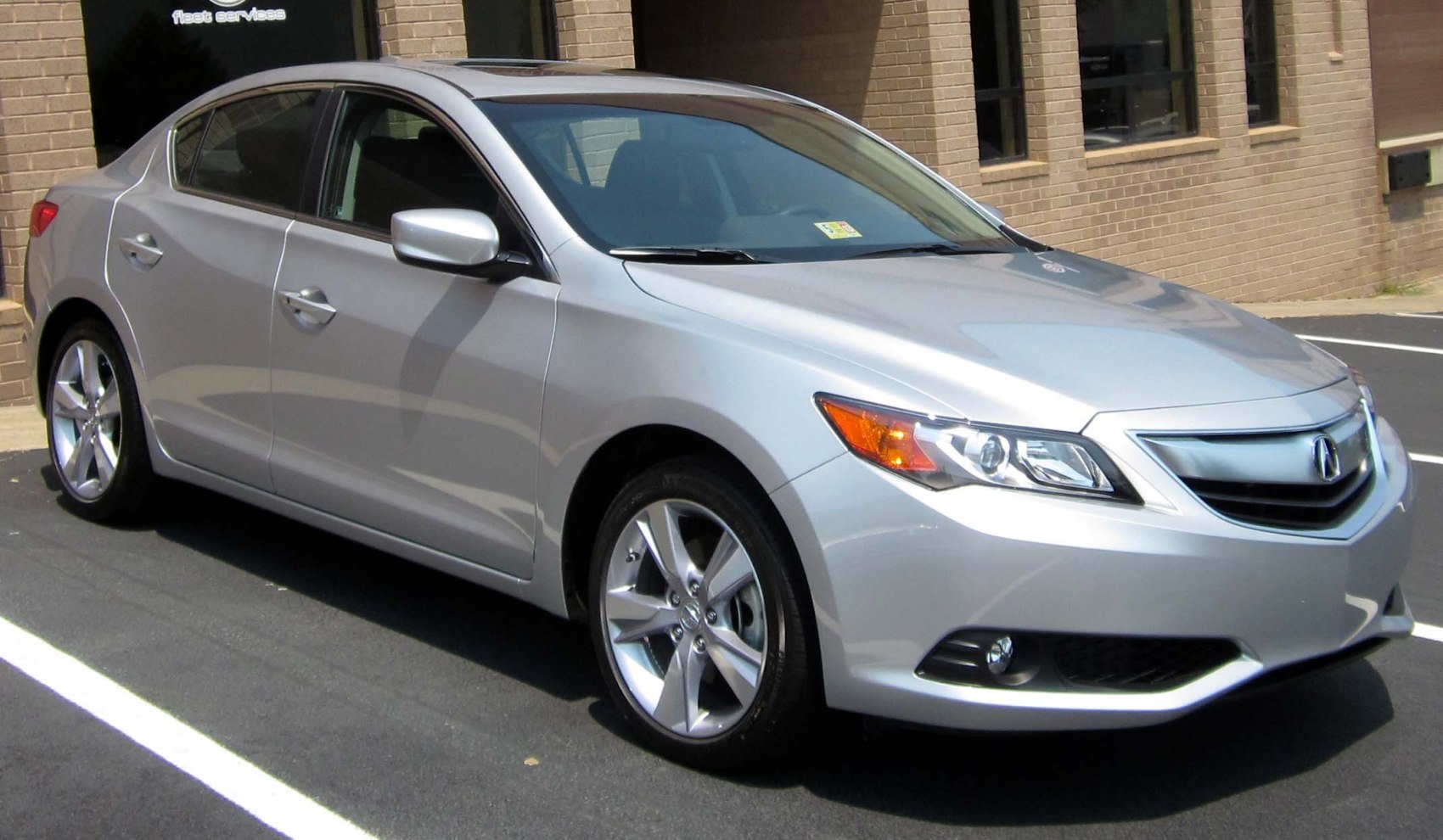Front side profile with alloy wheels and headlights