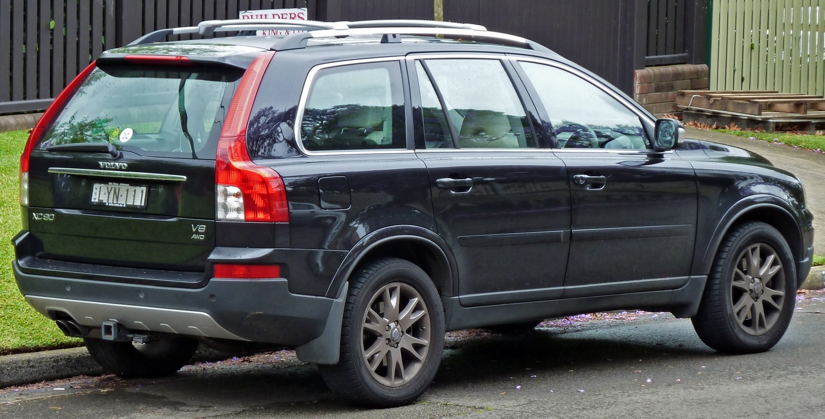 Rear view of SUV with vertical tail lights and roof rails