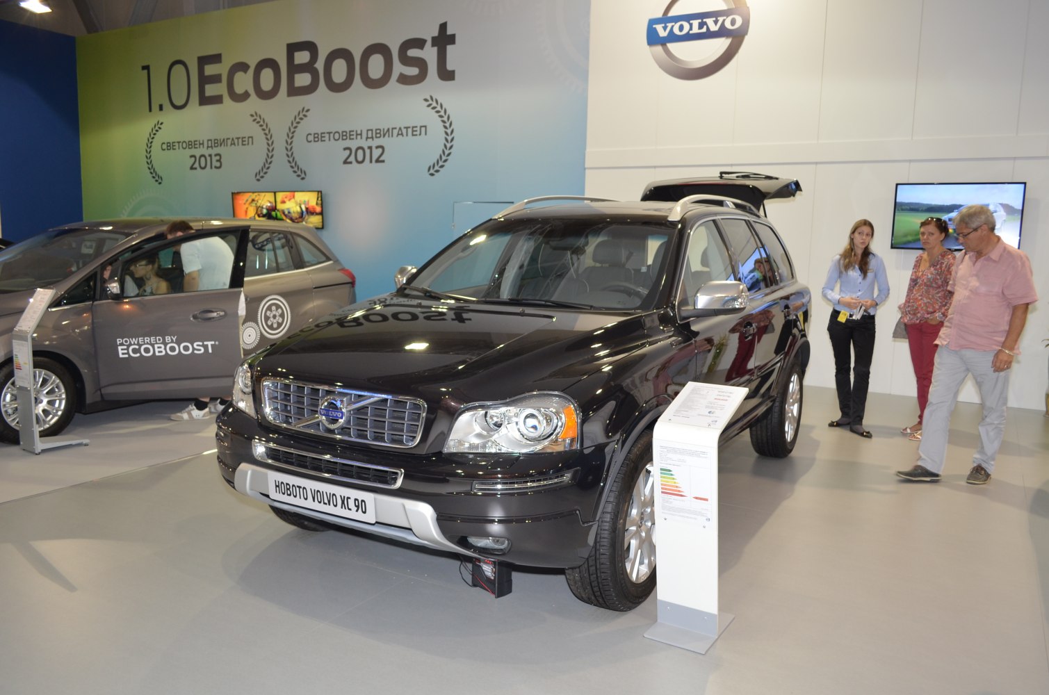 Front exterior view with grille and headlights plus display stand