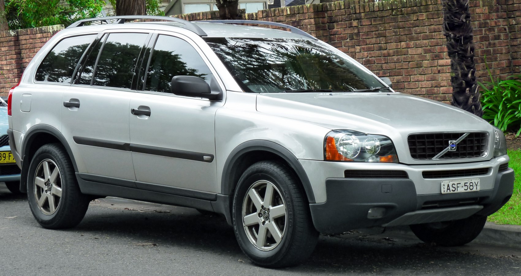 Silver SUV front side view with roof rails and alloy wheels