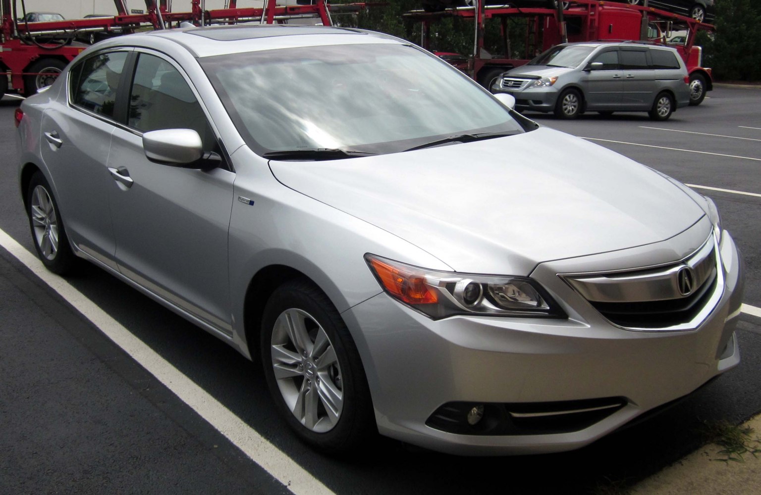 Front side view of sedan with alloy wheels and modern headlights