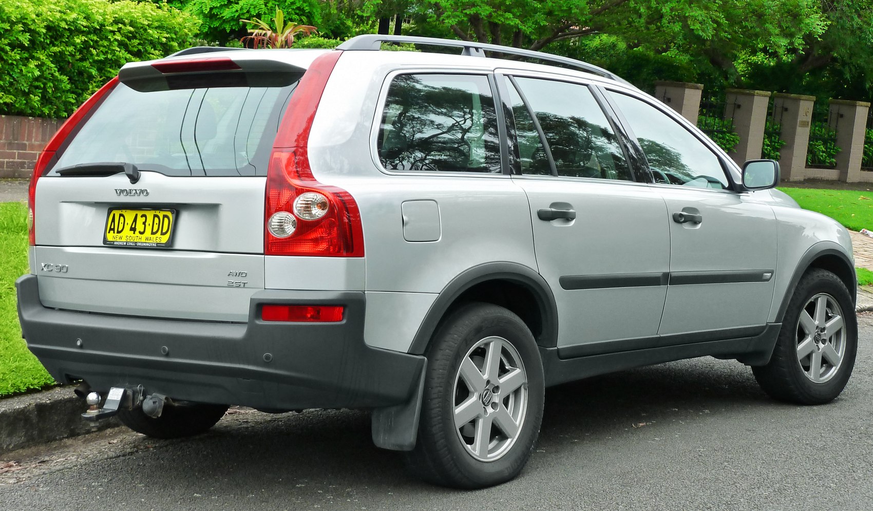 Rear and side view of silver SUV with AWD and 25T badges