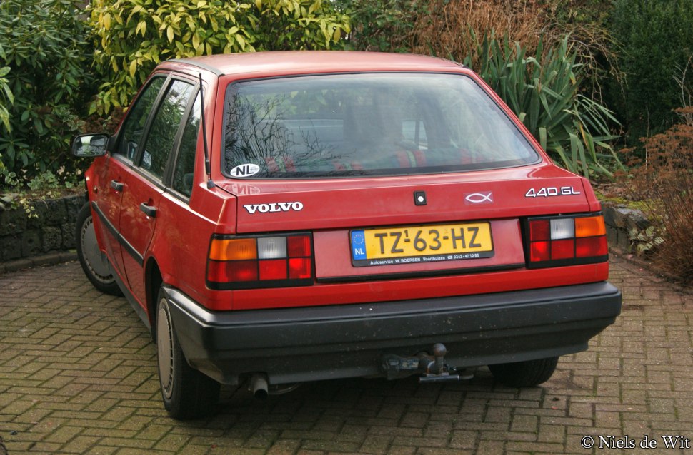 Rear and side hatchback view with distinctive taillights and emblem.