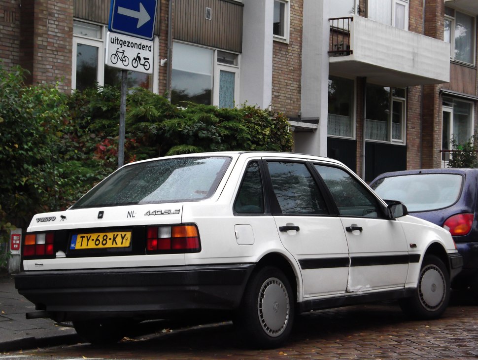 Rear and side view of white hatchback with distinct rectangular tail lights and angular design.
