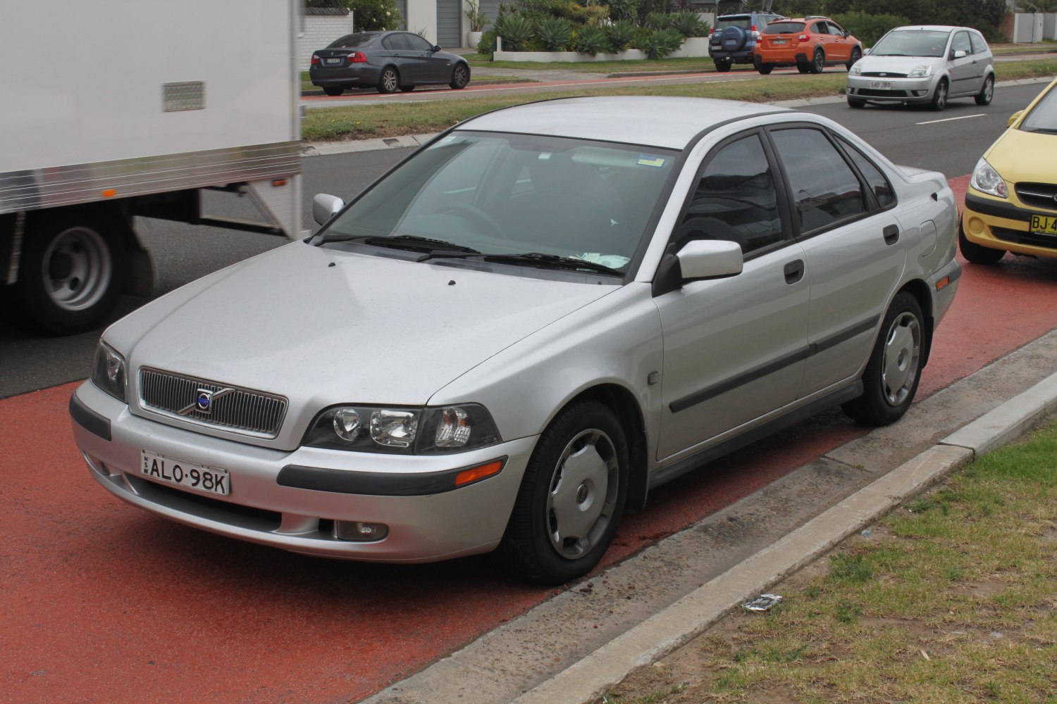 Silver sedan with classic front grille and dual headlights design
